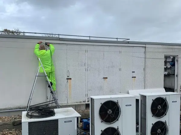Technician at work on a commercial rooftop